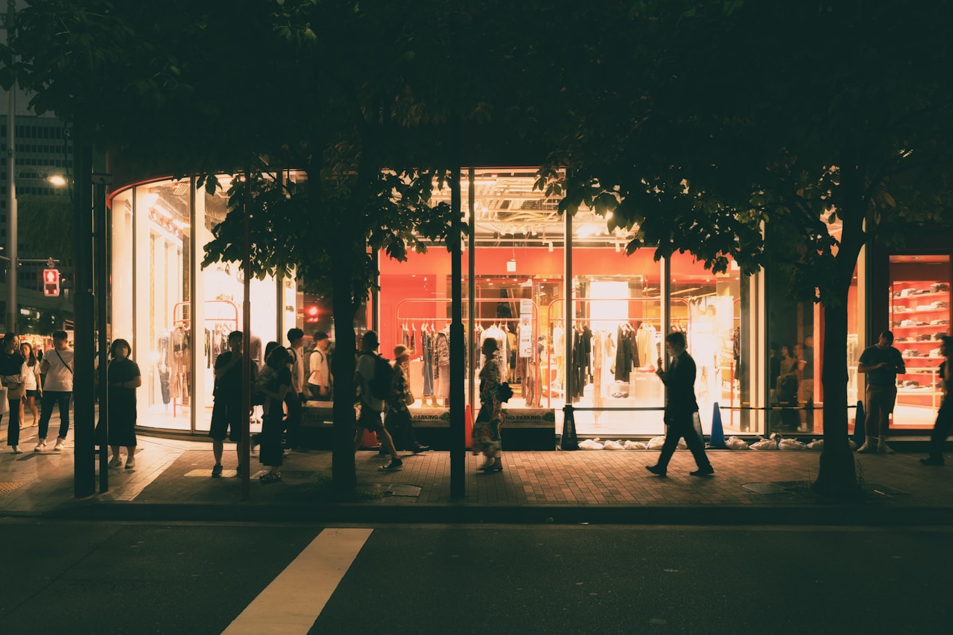 People walking on Ginza street in Tokyo at night